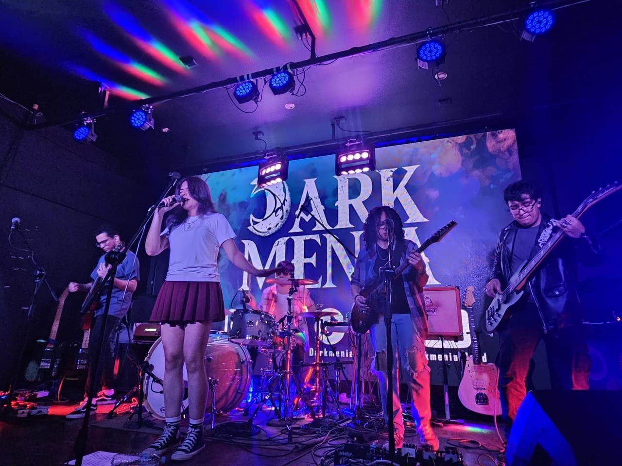 Darkmenia performing at Sante venue with stage lights